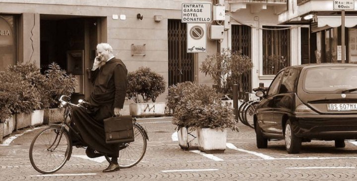 Italian Priest on phone